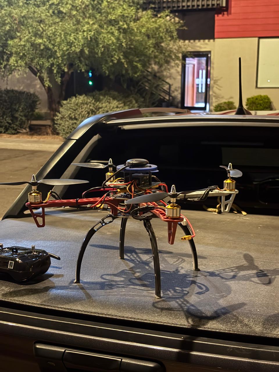 A custom-built drone resting on the back of a vehicle